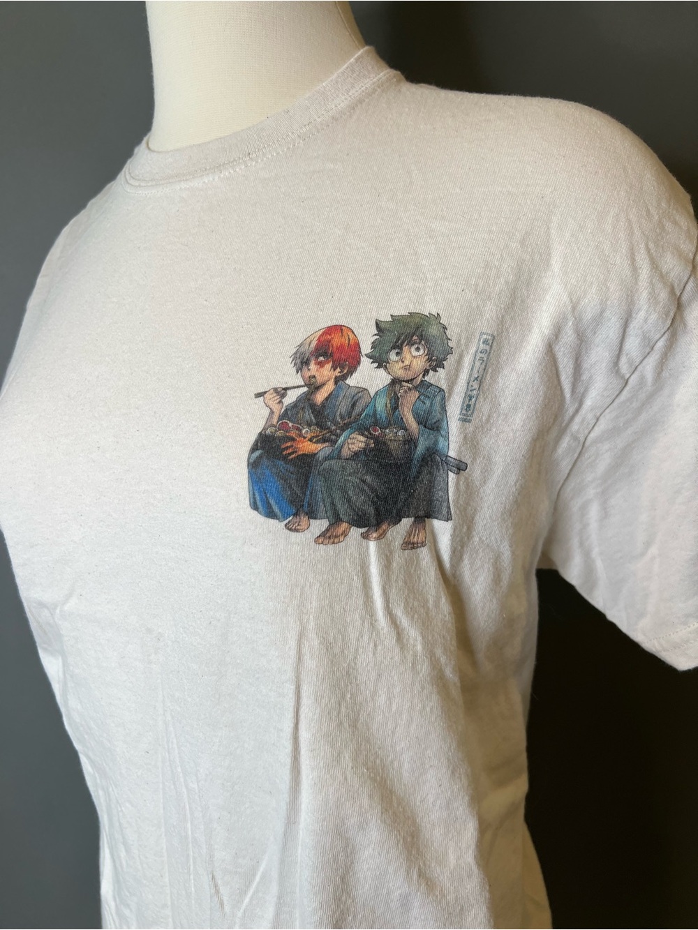 White Graphic Tee with Anime Characters